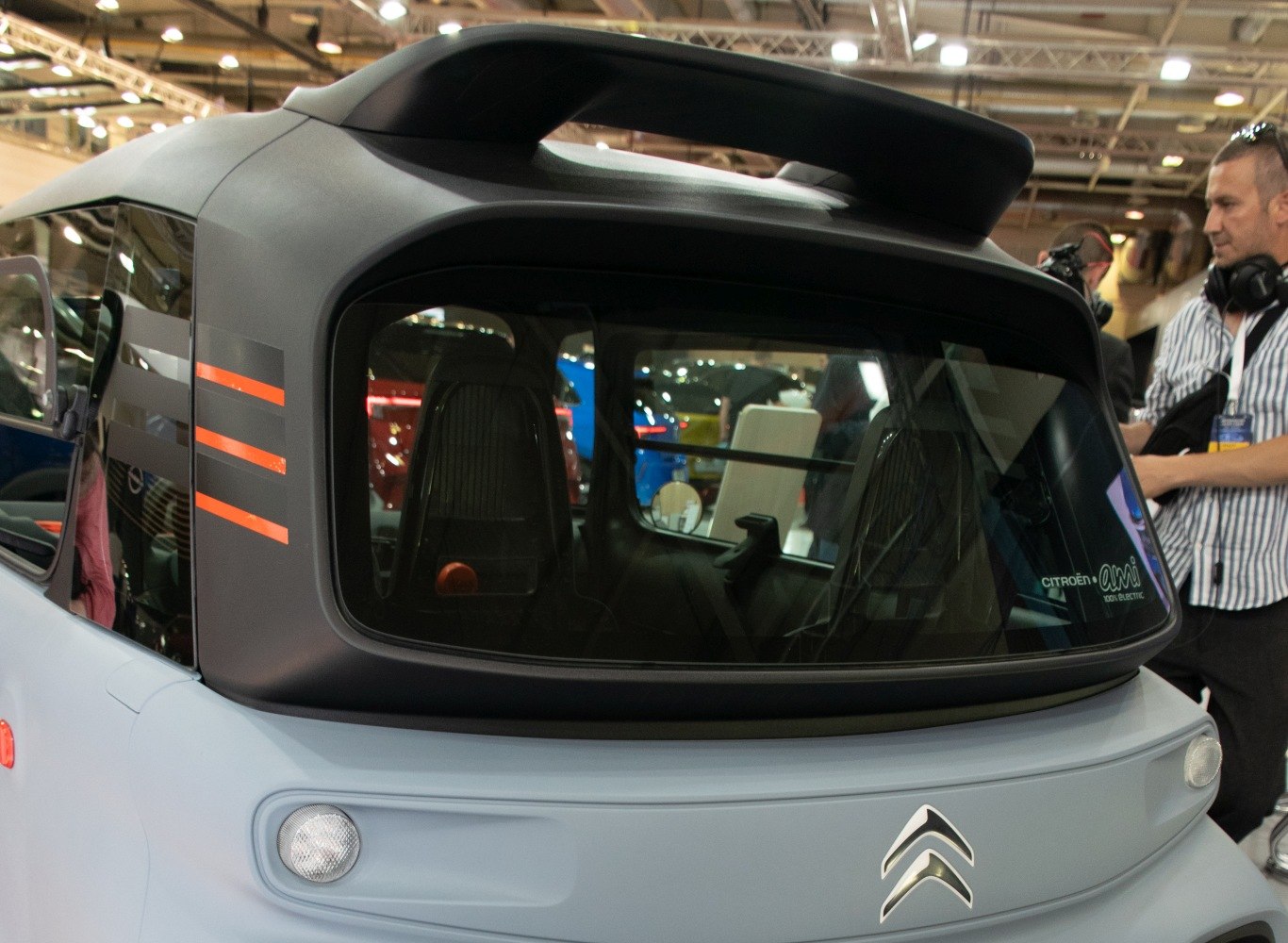 Rear design with large canopy window and compact electric vehicle features