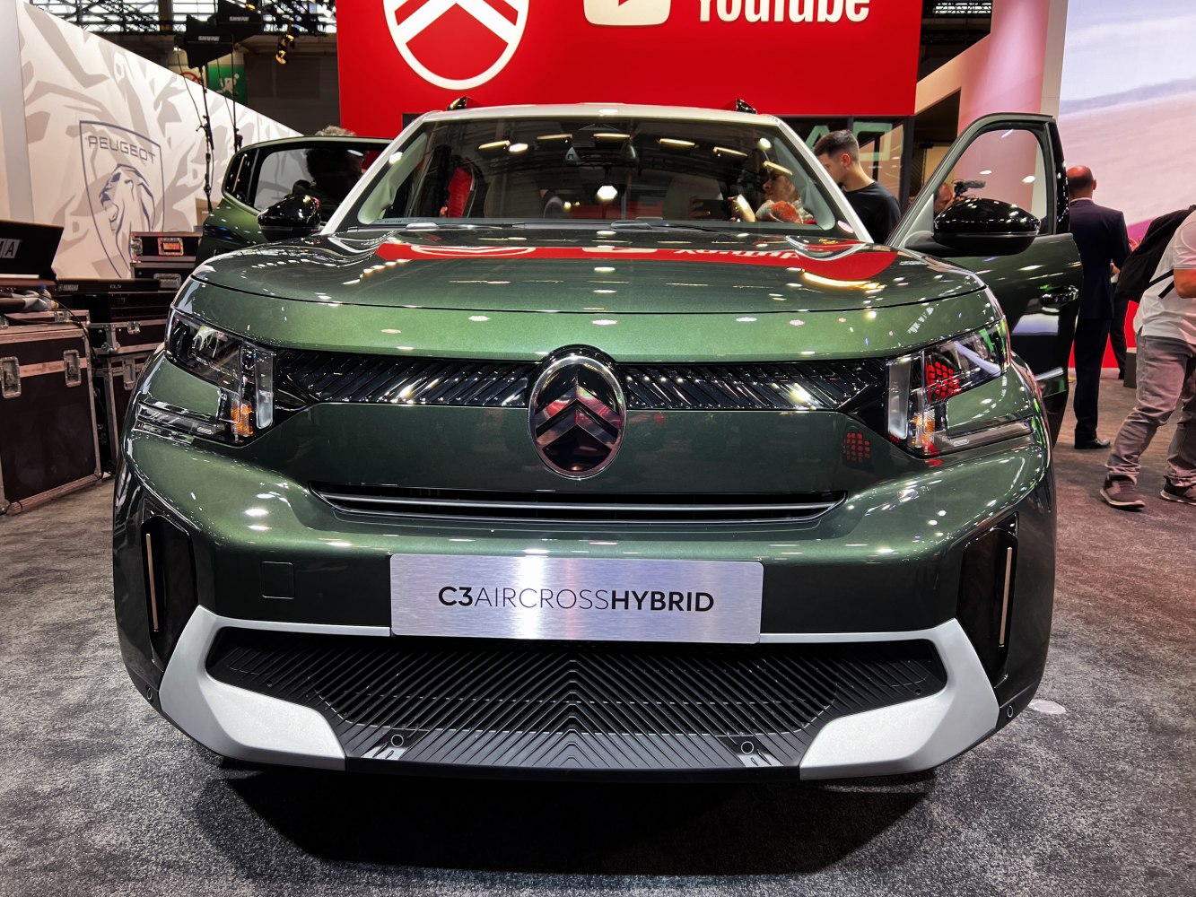 Front view of modern hybrid SUV with distinctive grille and LED headlights
