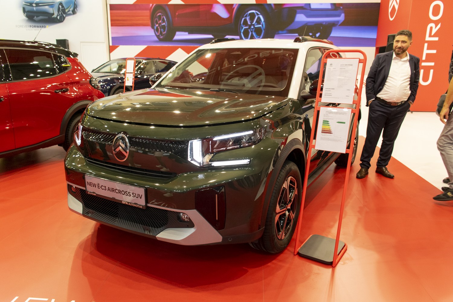 Modern electric SUV front view with bold grille and LED headlights