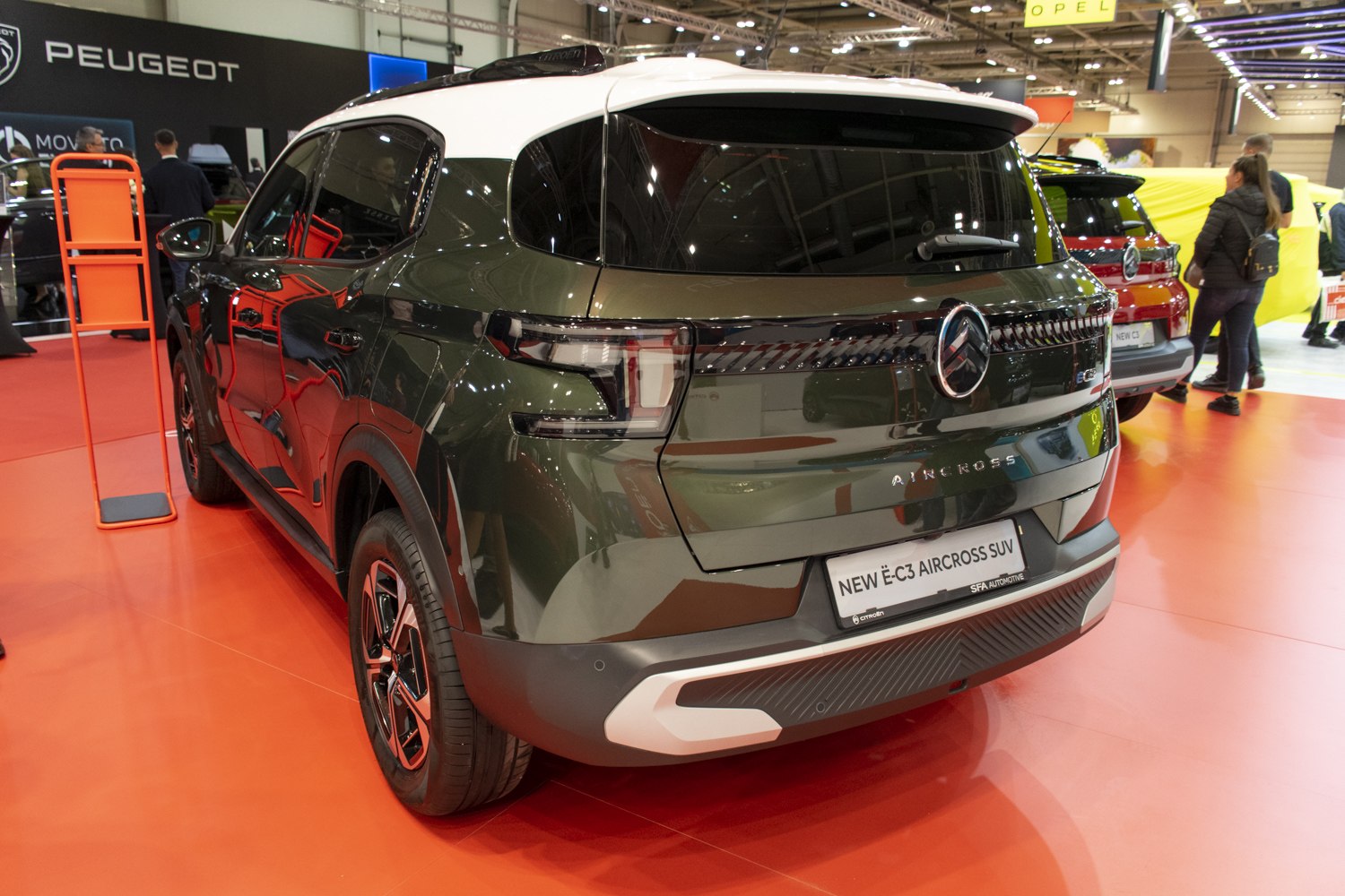 Rear view with distinctive tail lights and two-tone roof