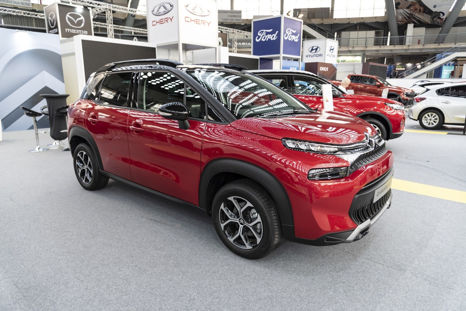Front and side view of a compact SUV with distinctive lighting and modern design