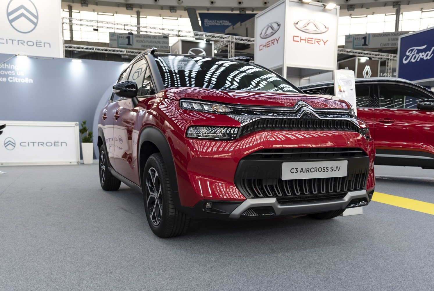 Front view of a compact SUV with split headlights and modern grille