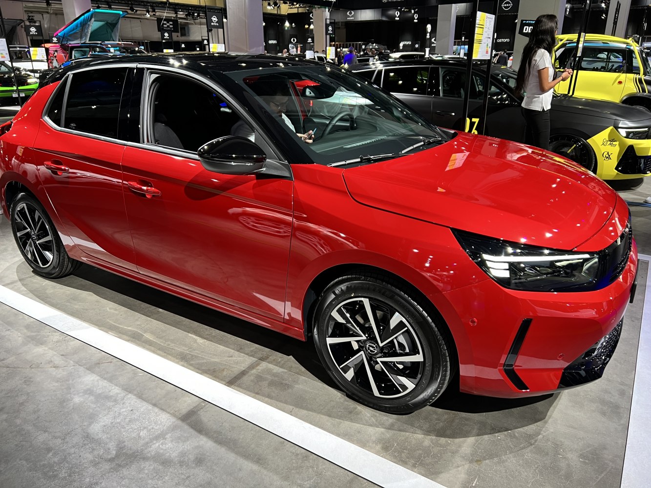 Red compact hatchback with LED headlights and alloy wheels