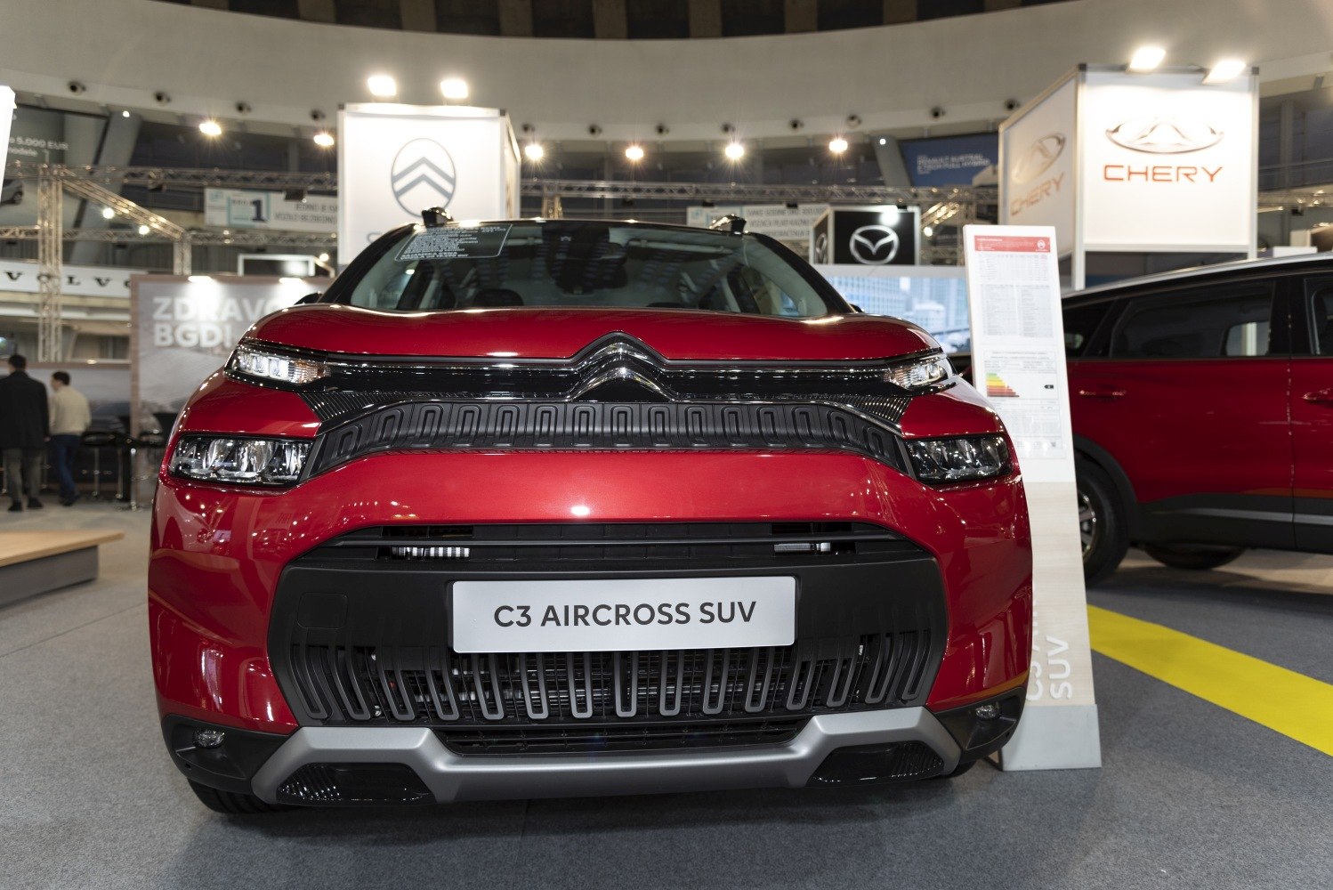 Front view showing grille and split headlight design