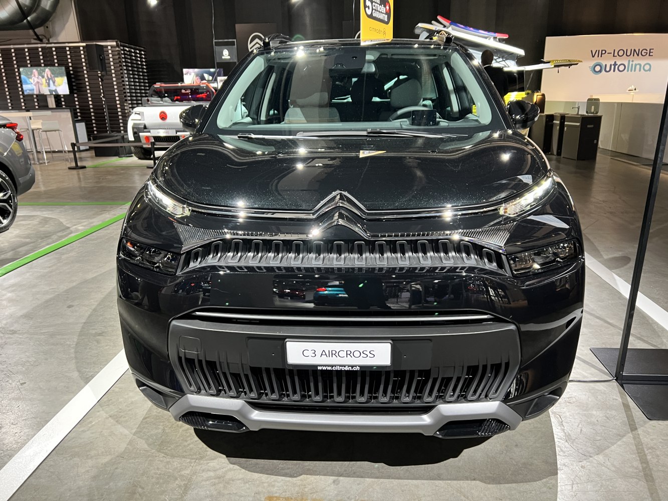 Modern SUV front fascia with grille and multi-level headlights