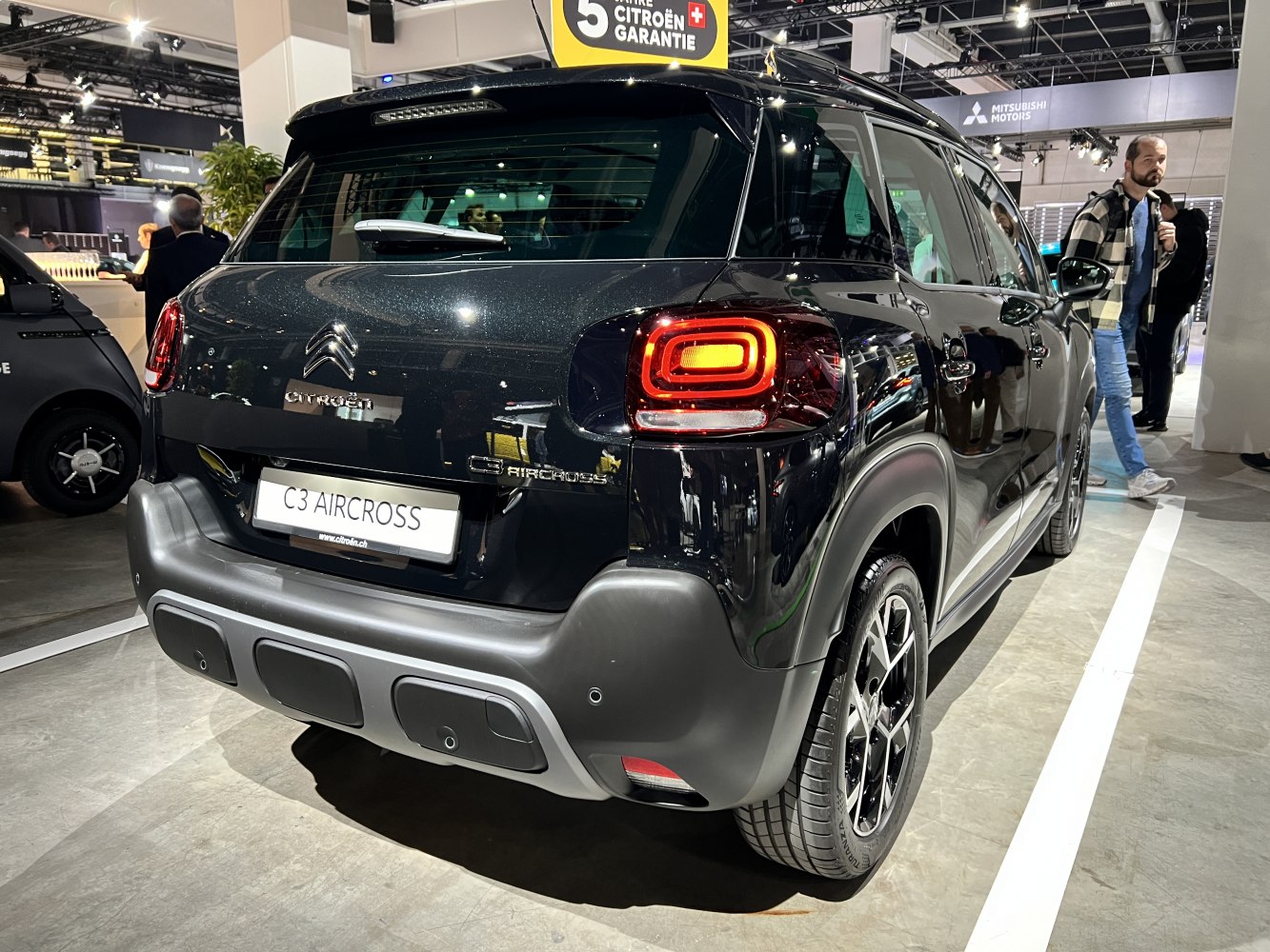 Rear view with distinct tail lights and rear bumper design