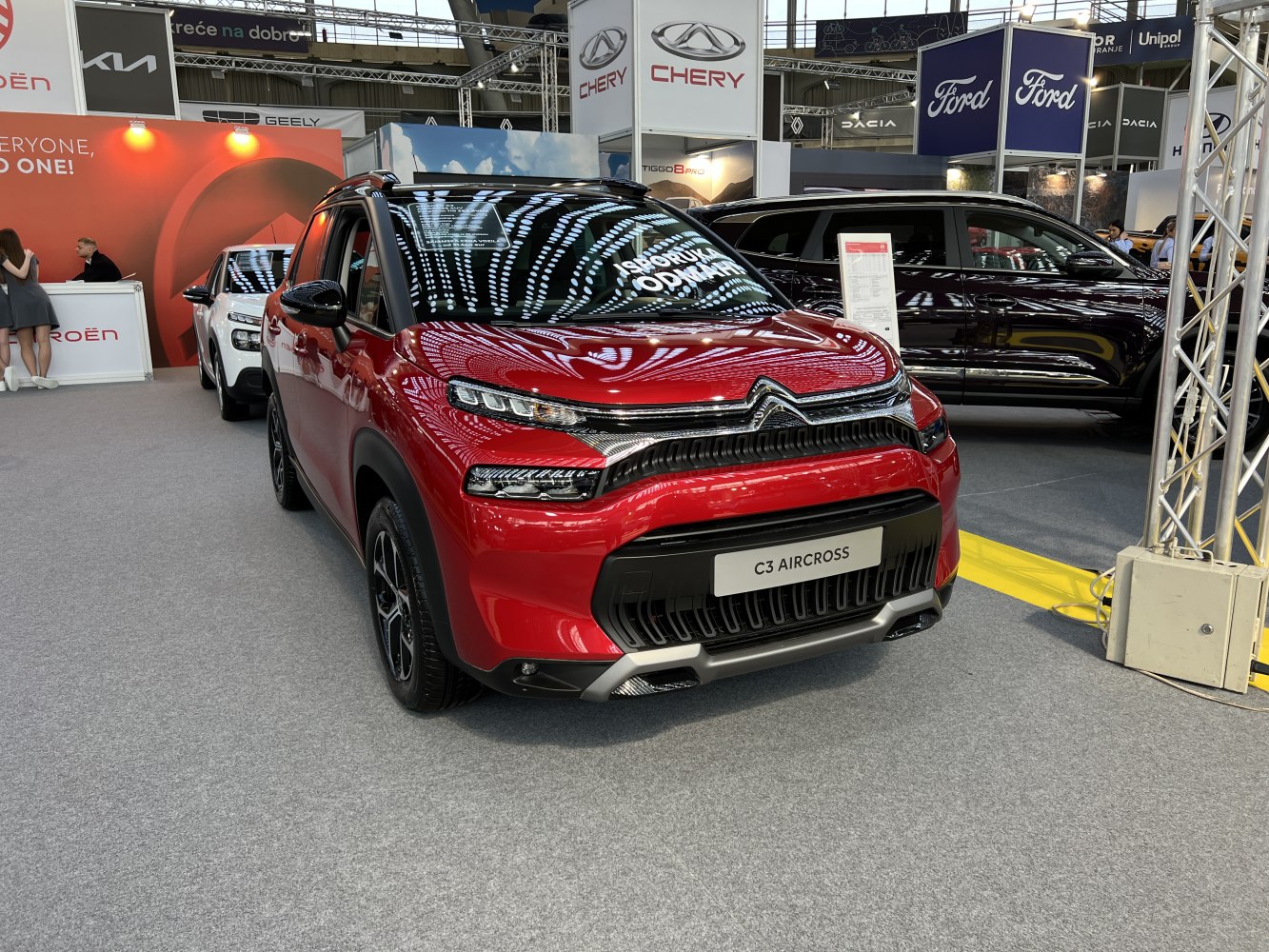Front view of SUV with distinctive LED headlights and grille design