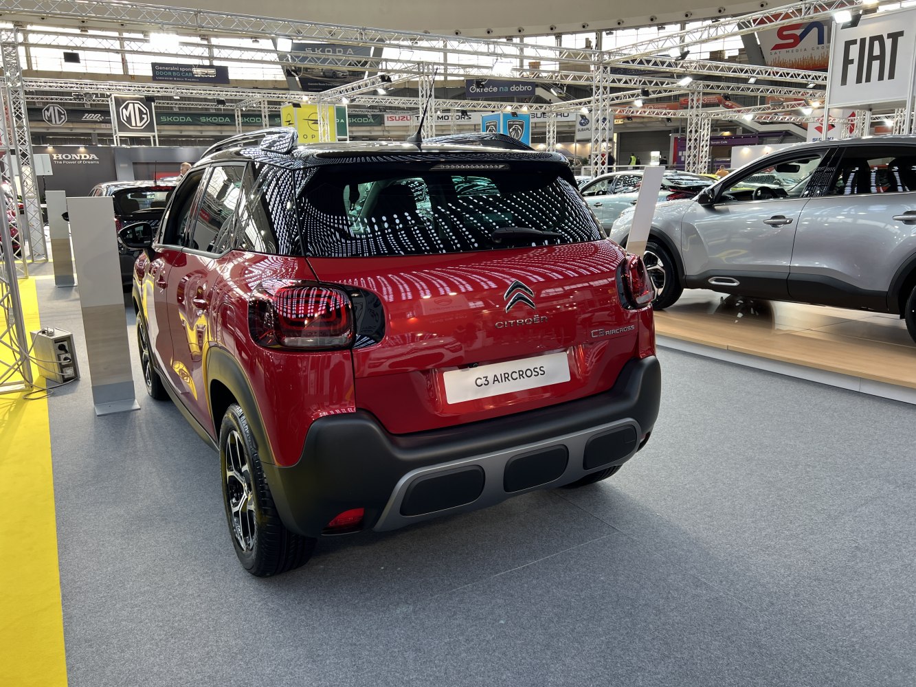 Rear view of a compact SUV with distinctive taillights and a black roof.