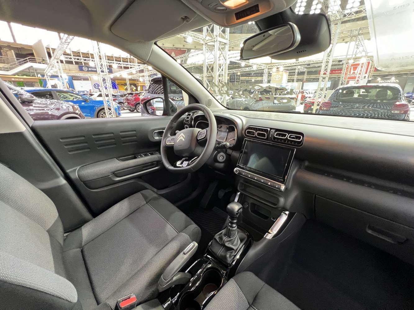Compact SUV interior with manual transmission and touchscreen dashboard