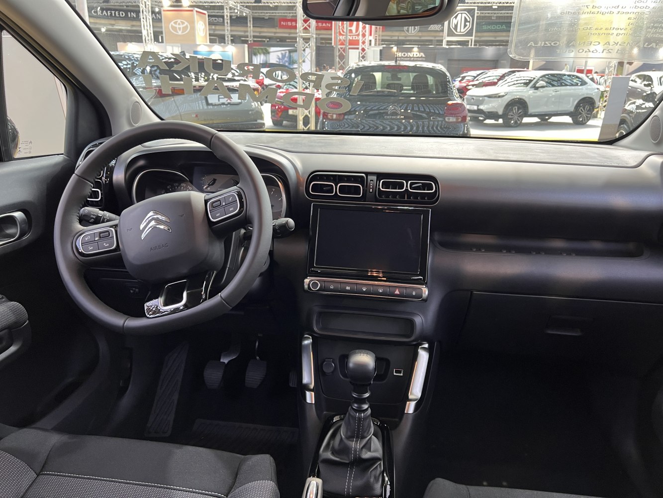 Dashboard, steering wheel, touchscreen, manual gear shift interior view