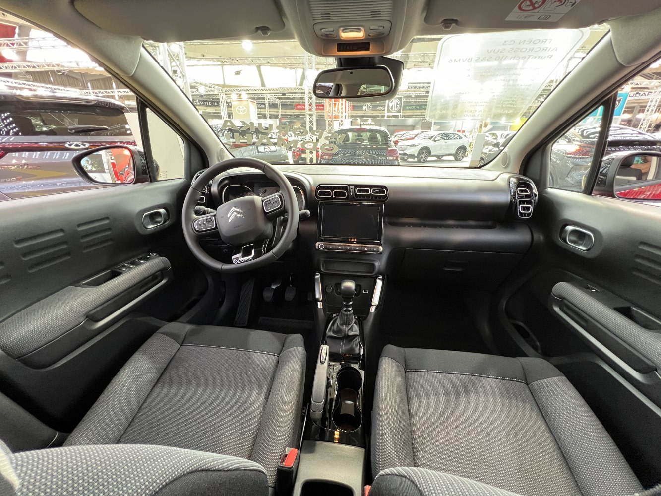Dashboard with touchscreen and front seats in compact SUV interior