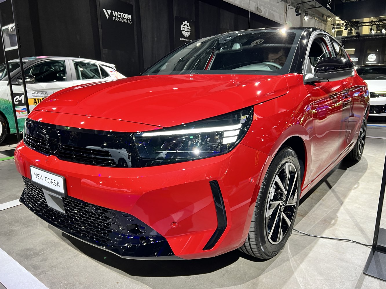 Front design and LED headlights of a red compact hatchback