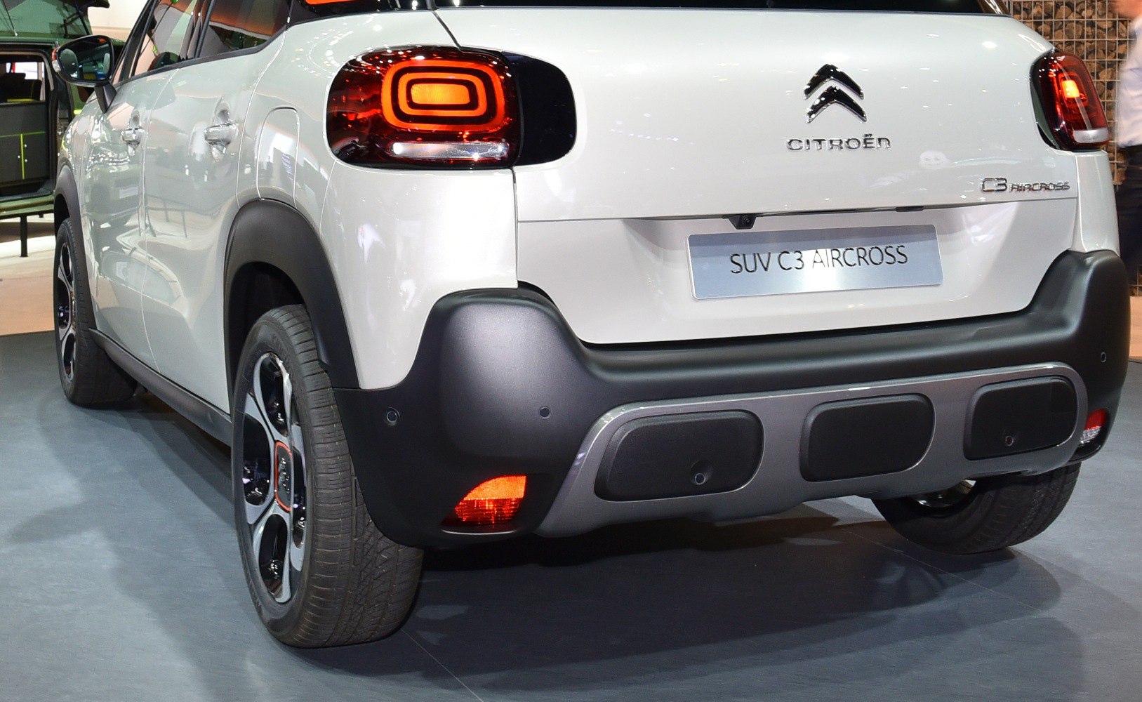 Rear view with distinct tail lights and protective bumper design