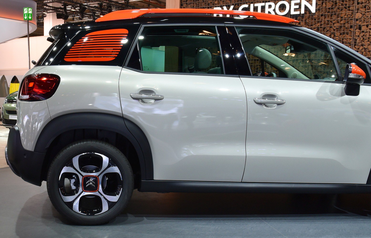 Side profile with rear window louvers and distinctive alloy wheel