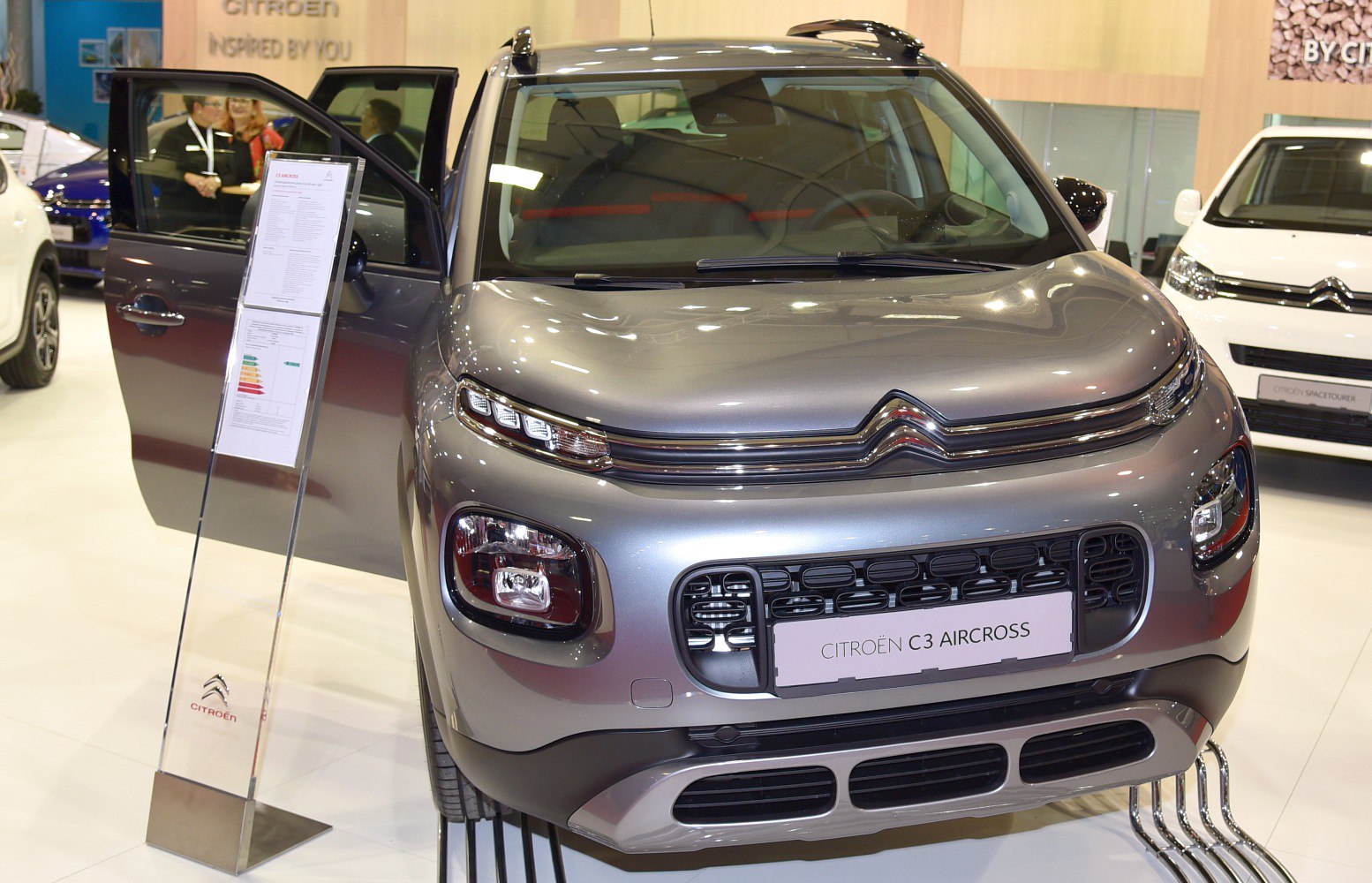 Modern SUV front with split headlights and bold grille design
