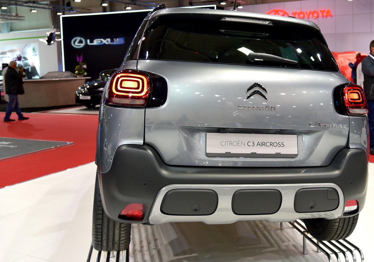 Rear of a compact SUV with illuminated square-shaped taillights and a distinct bumper design