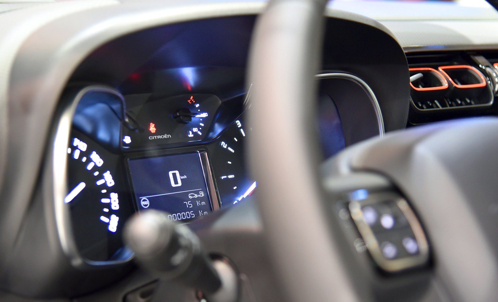 Digital instrument cluster with speedometer and dashboard controls