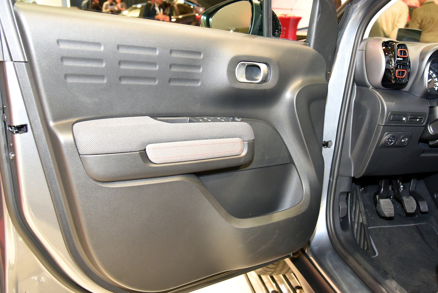Interior door panel with controls and dashboard details