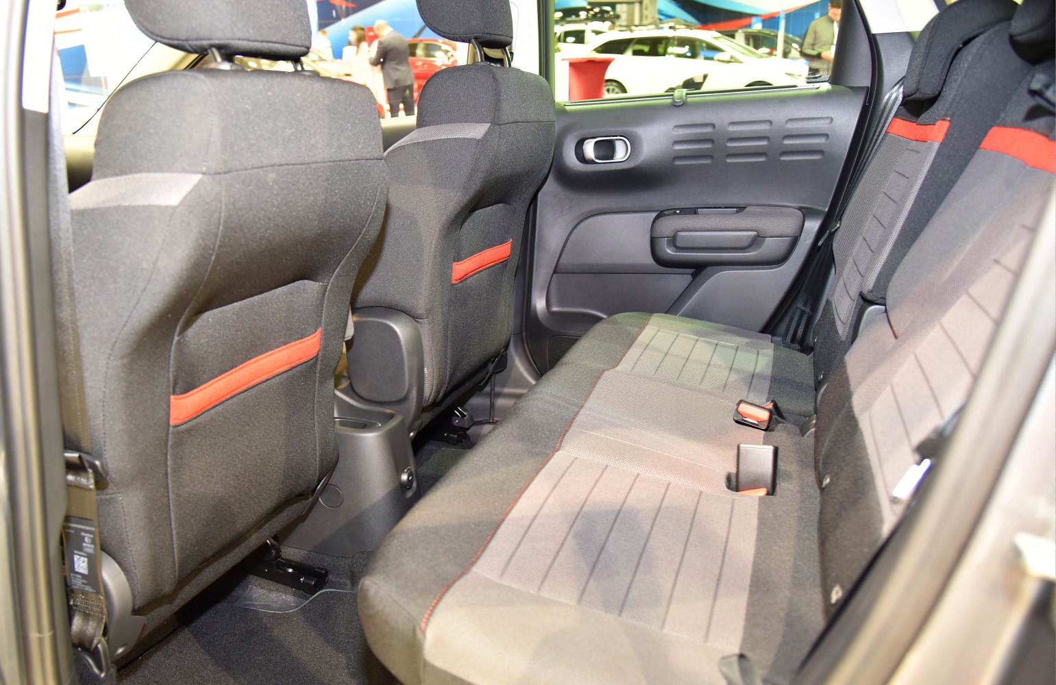 Rear seating with fabric upholstery and ergonomic design in compact SUV.