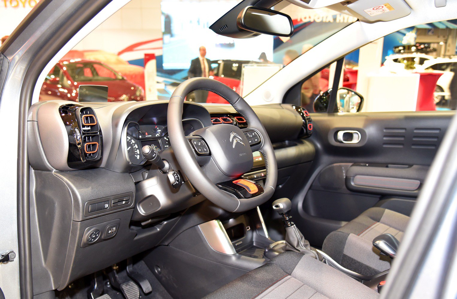 Dashboard, steering wheel, gear shift inside car cabin