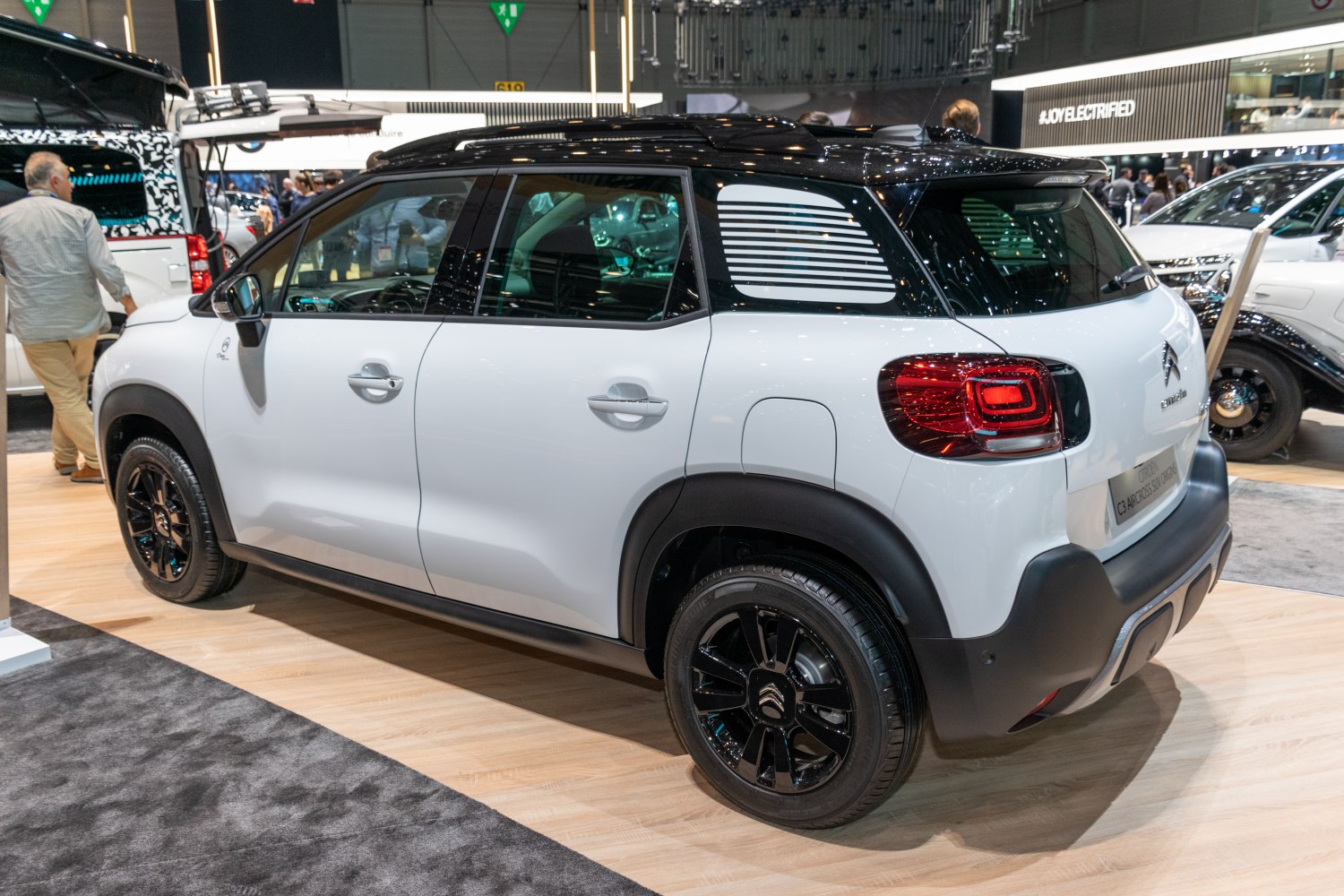 Rear and side profile of compact SUV with distinctive rear lights and black roof