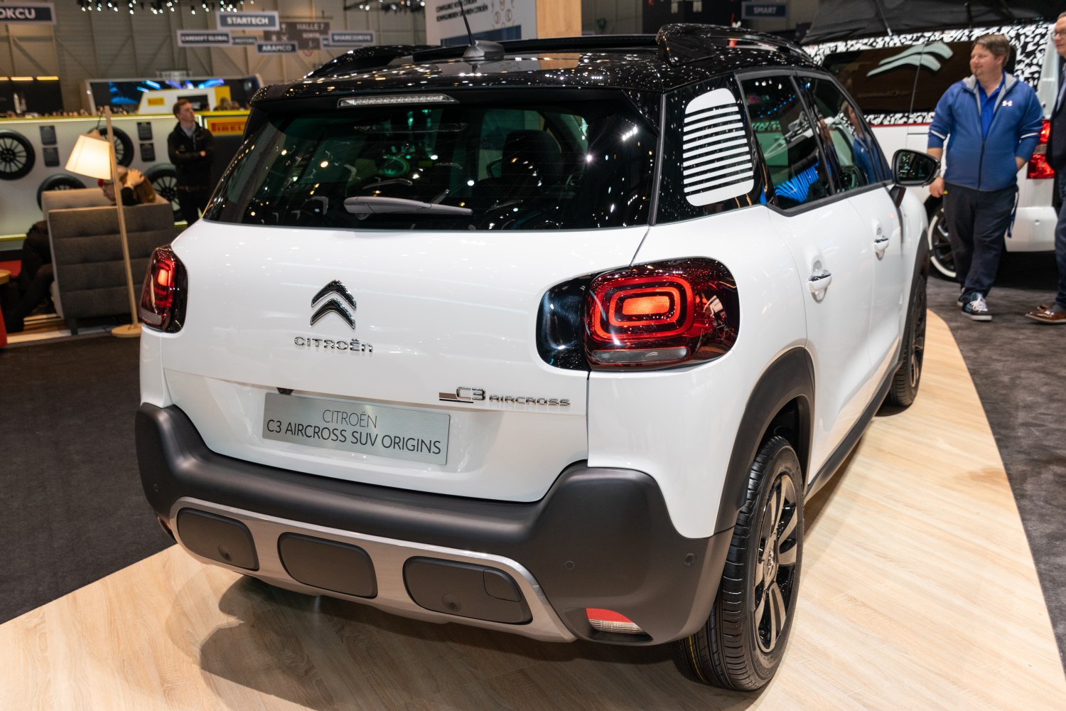 Rear view with distinct taillights and black roof detailing