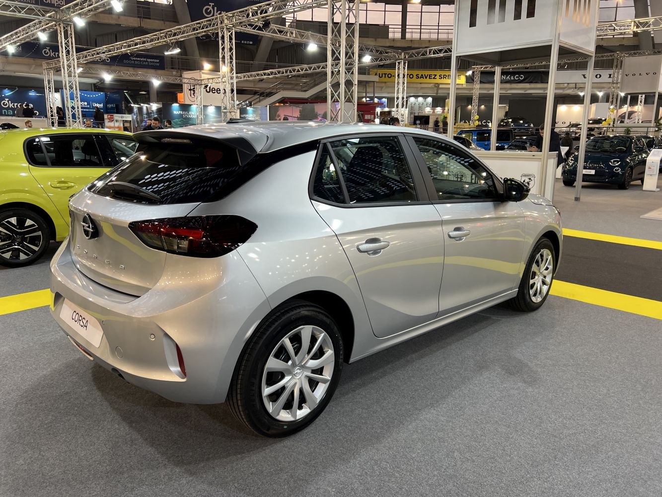 Rear three-quarter view of a sleek hatchback with alloy wheels