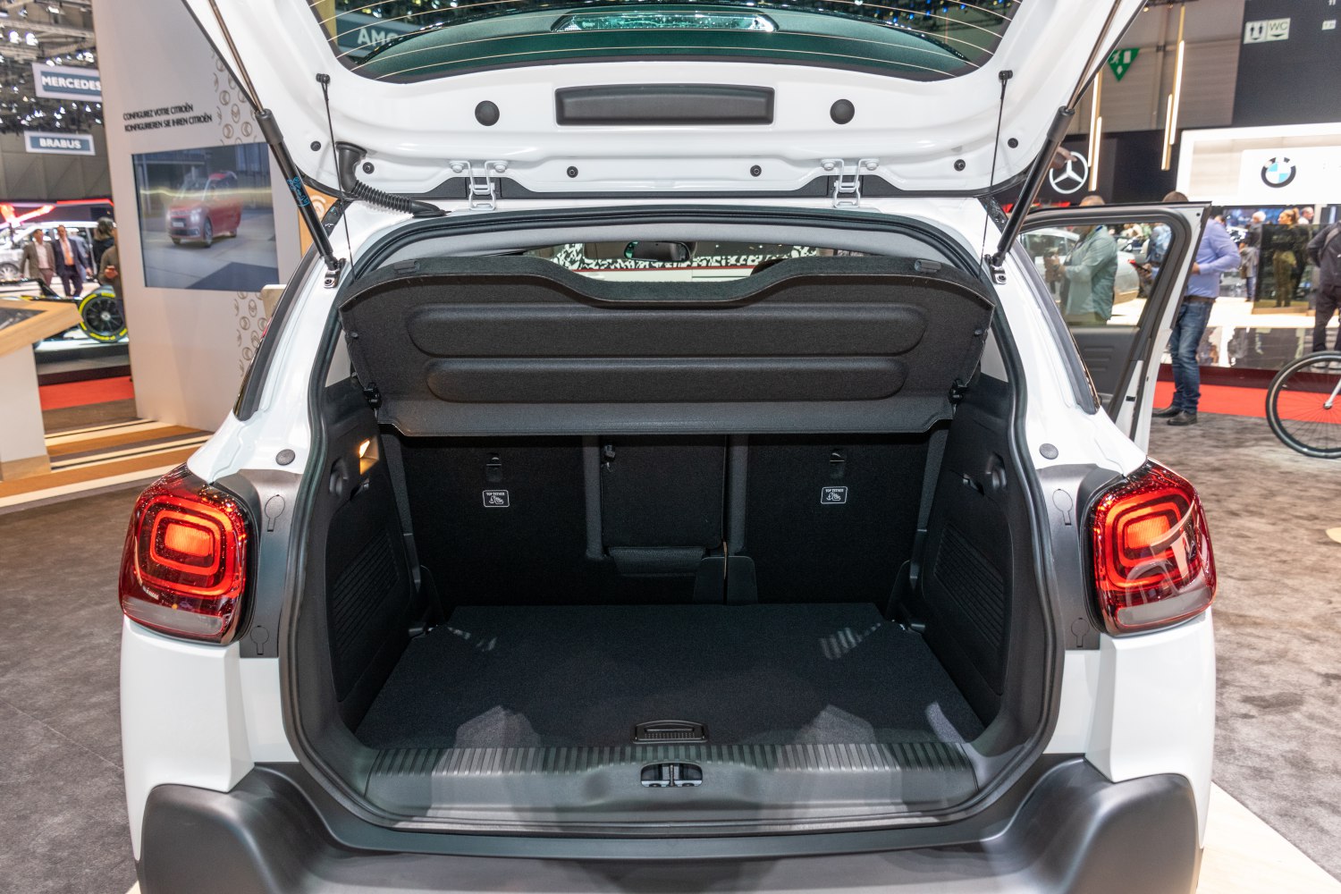 Open trunk with spacious rear cargo area and protective cover