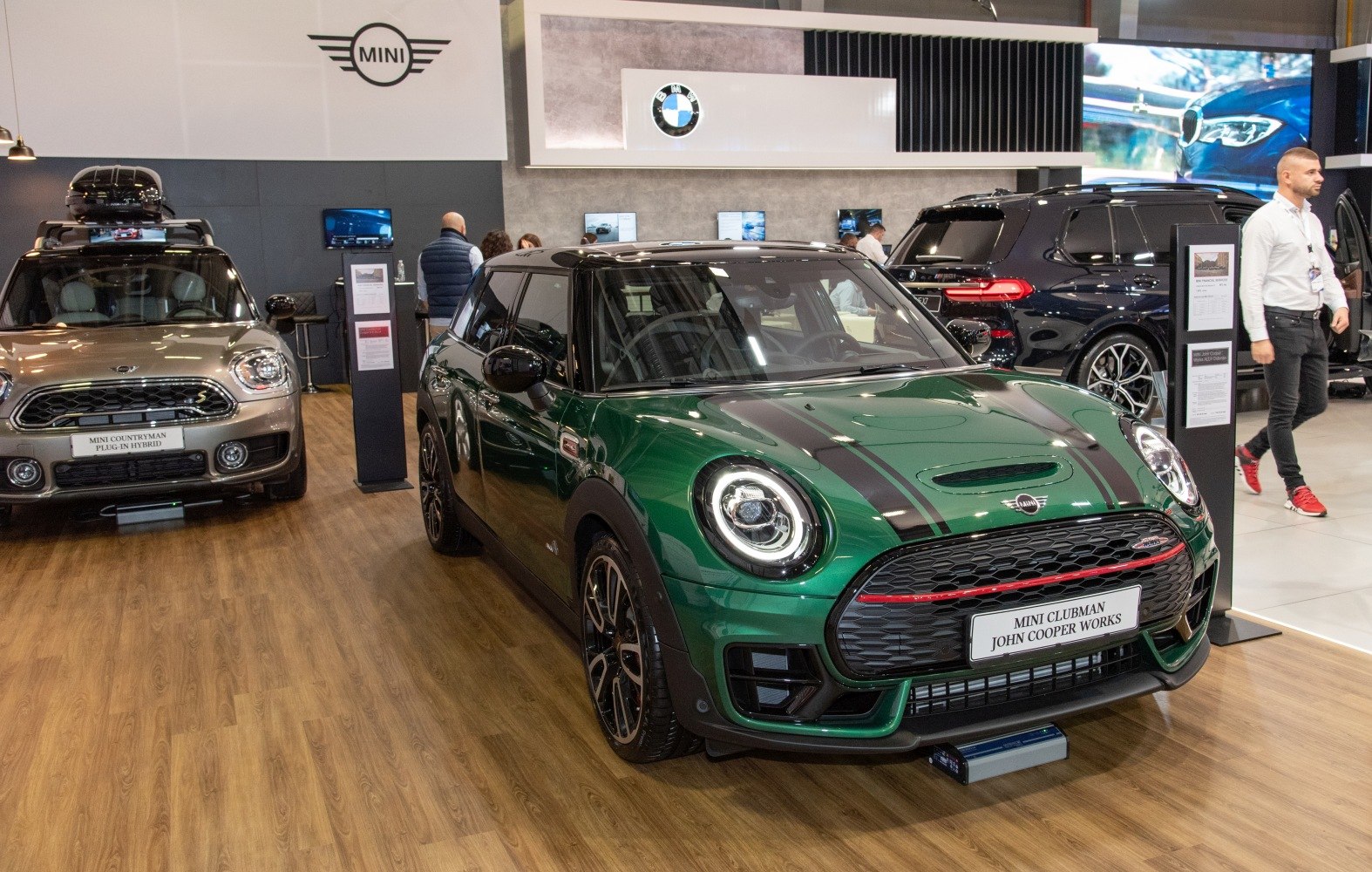Sporty green car front with distinctive round headlights and grille
