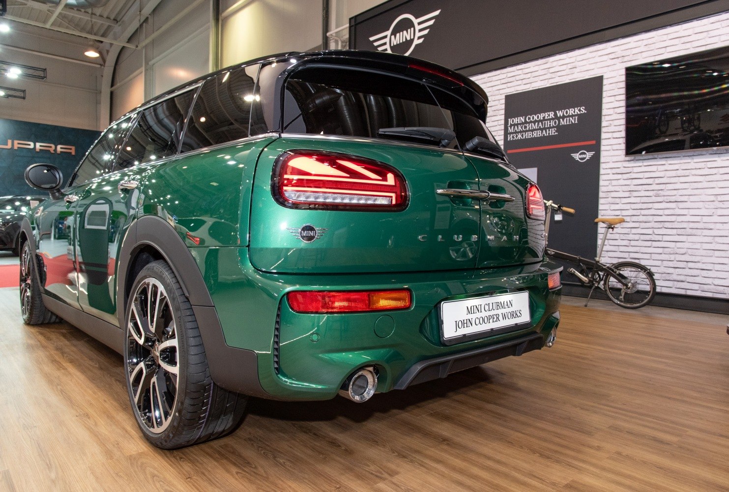 Sporty rear design with split taillights and dual exhaust.
