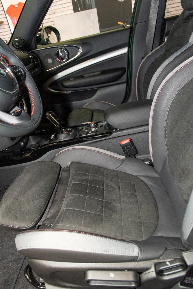 Quilted seats with adjustable features and modern center console inside car interior