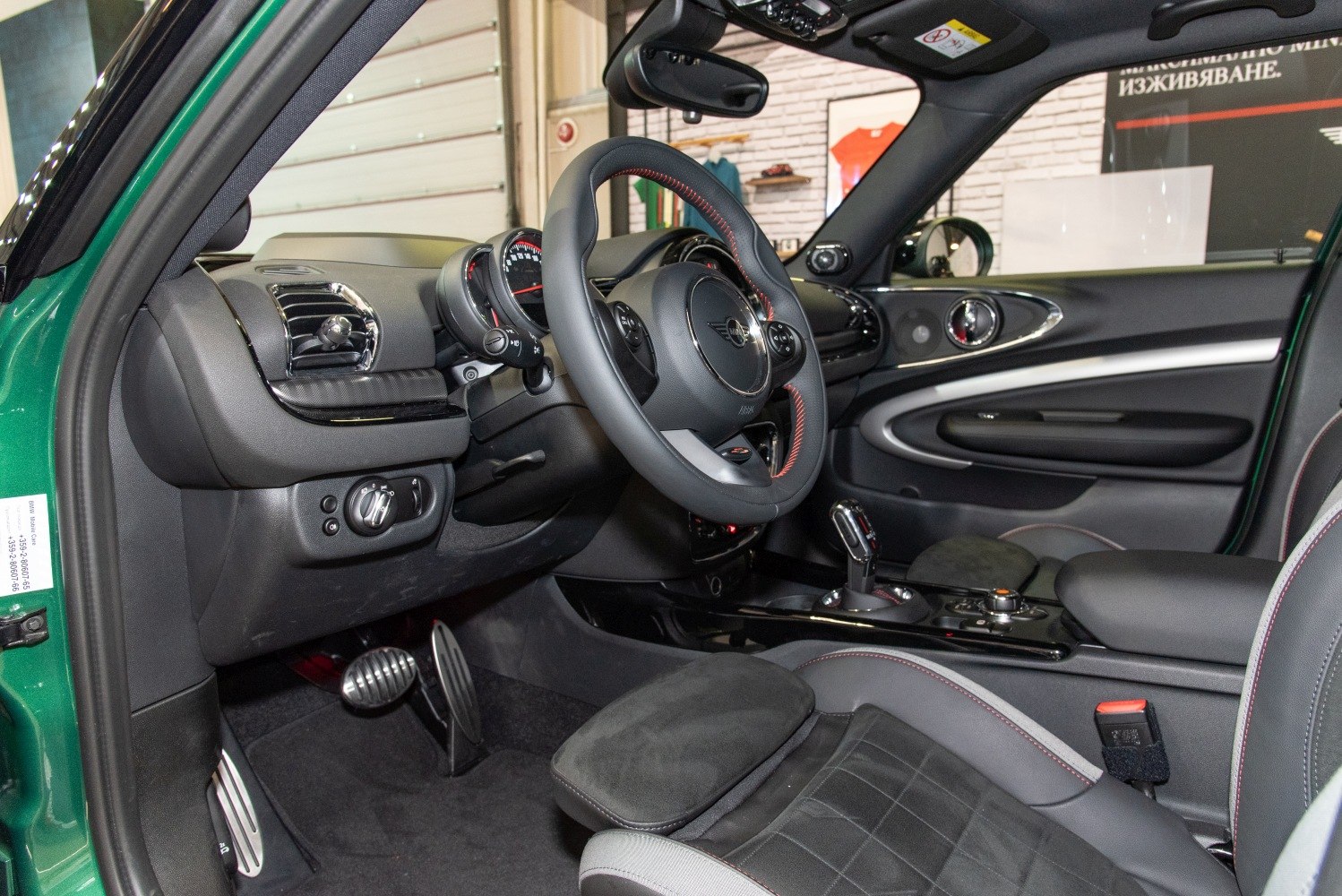 Sporty steering wheel and dashboard interior with ergonomic controls