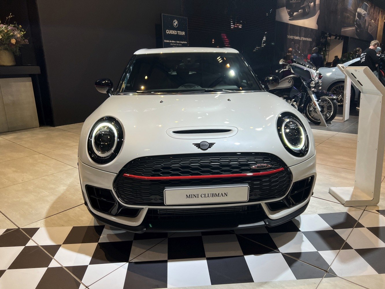 Front view with LED ring headlights and honeycomb grille with red accent