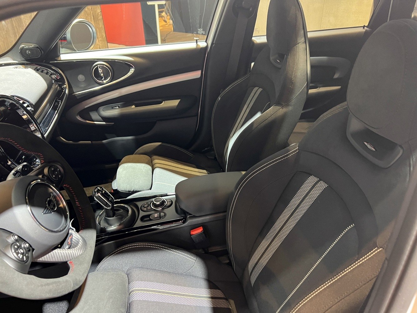 Sporty front seats and modern car interior controls