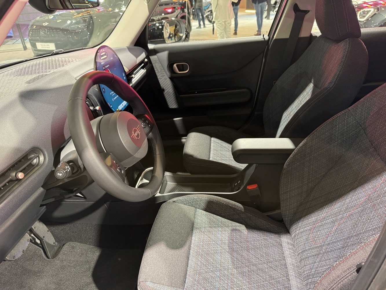 Digital dashboard display and fabric seats in car interior
