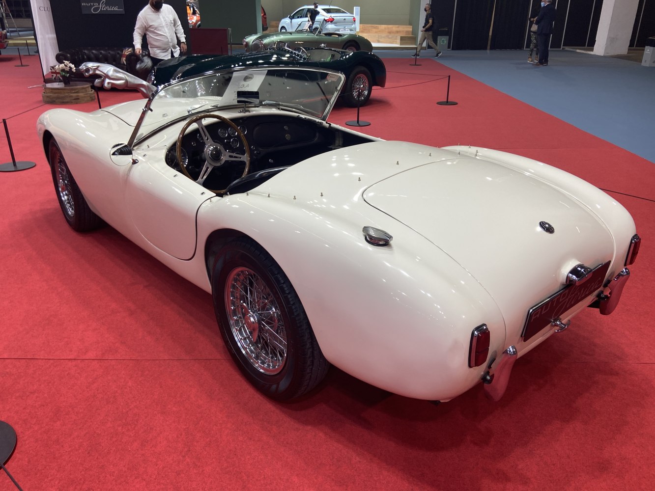 Sleek 1950s roadster with wire-spoke wheels and open two-seater cockpit