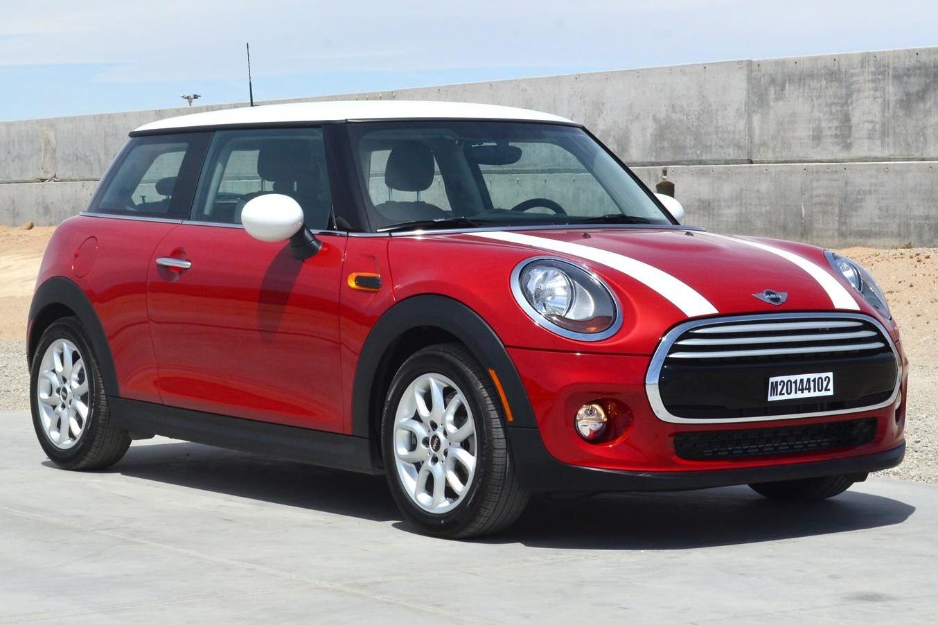 Red 3-door hatchback with white roof and racing stripes