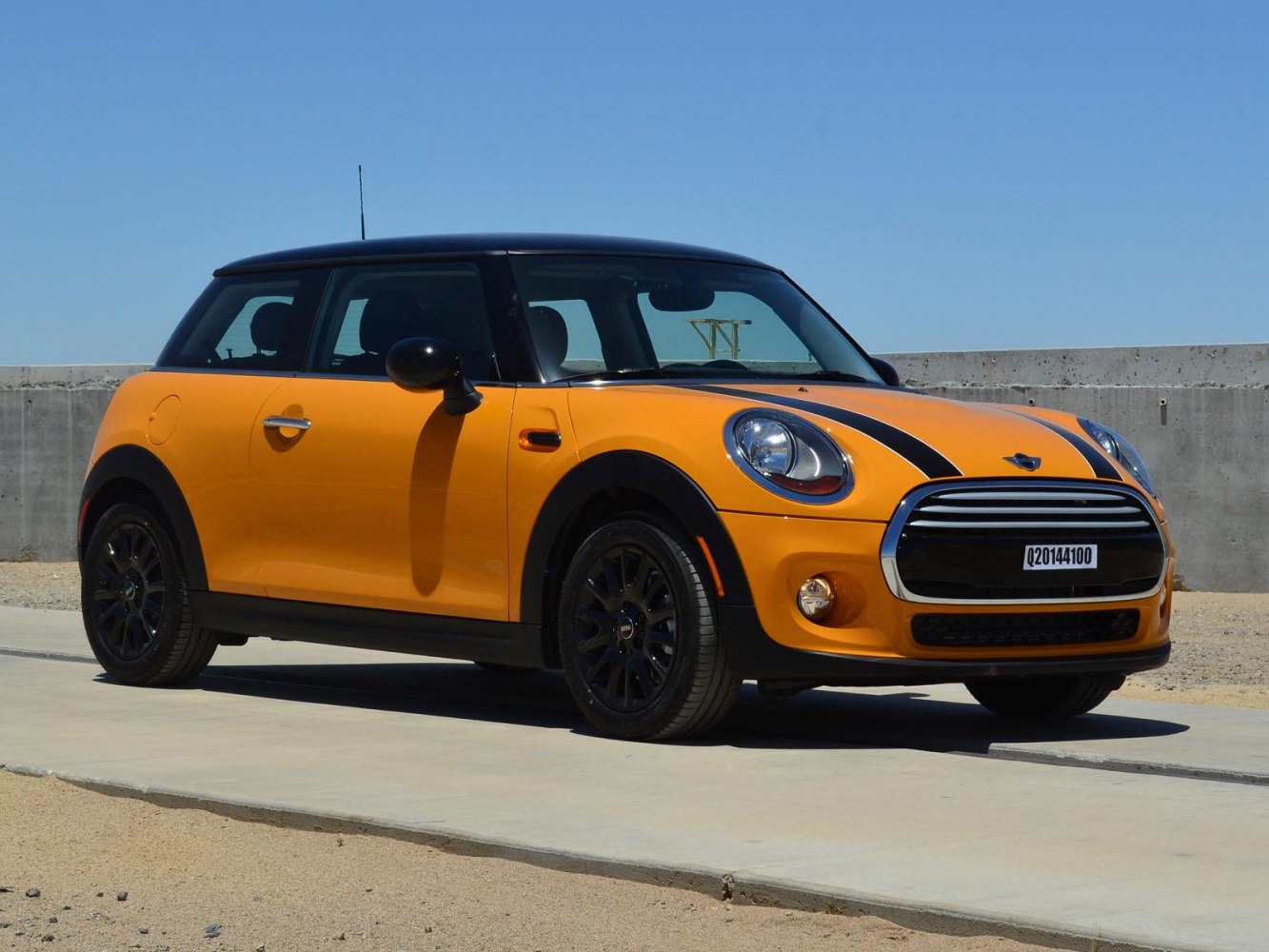 Compact hatchback with black racing stripes and black alloy wheels