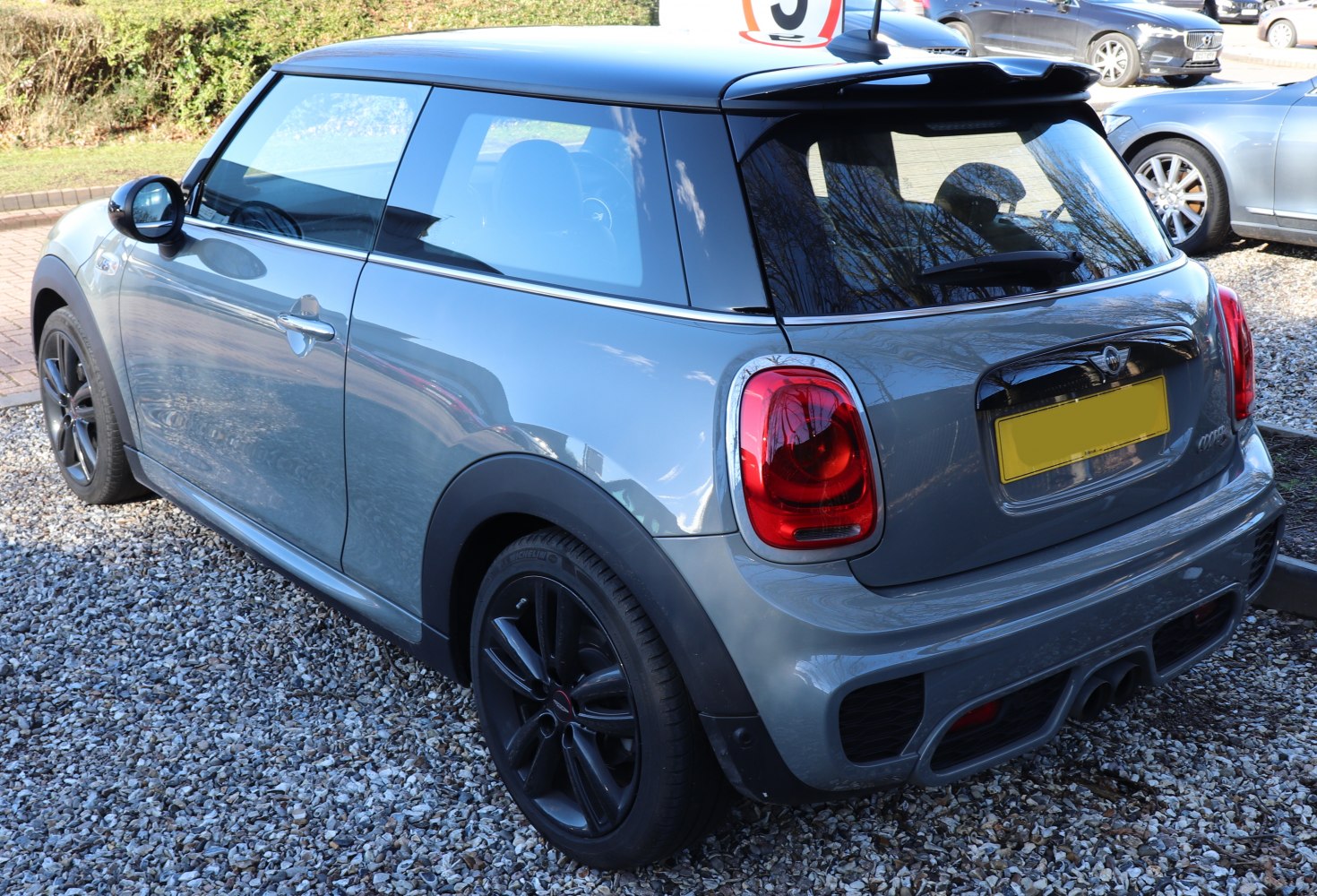 Rear view of compact hatchback with distinctive taillights and sporty features