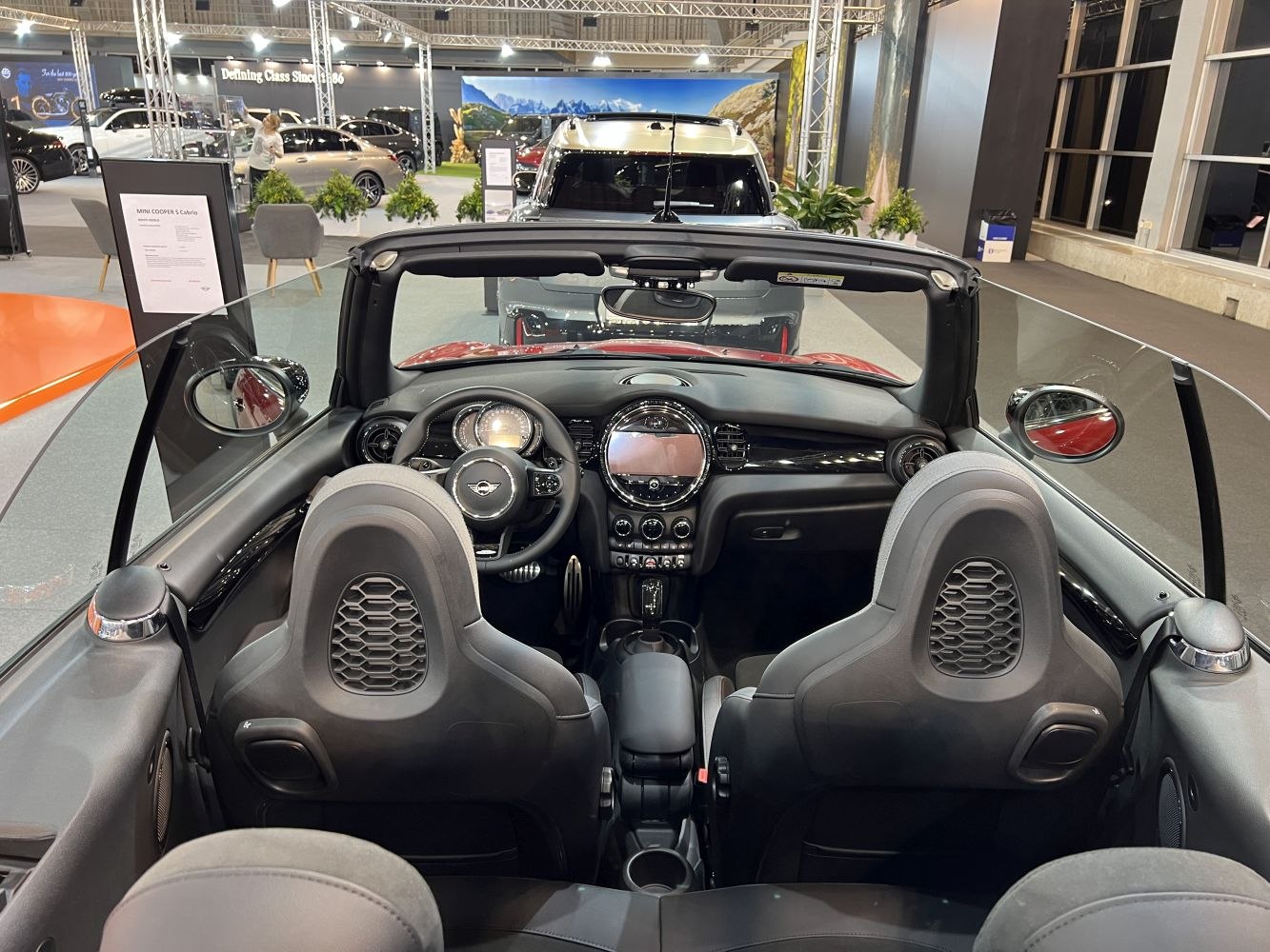 Modern open-top convertible interior with dashboard and luxury seats