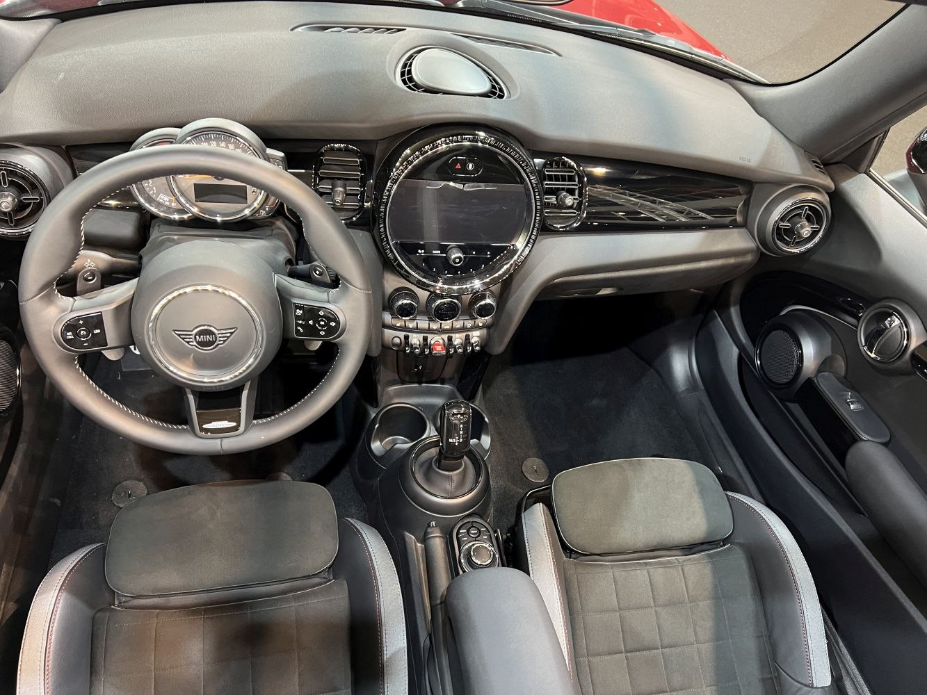 Dashboard and steering wheel with central touchscreen and control switches