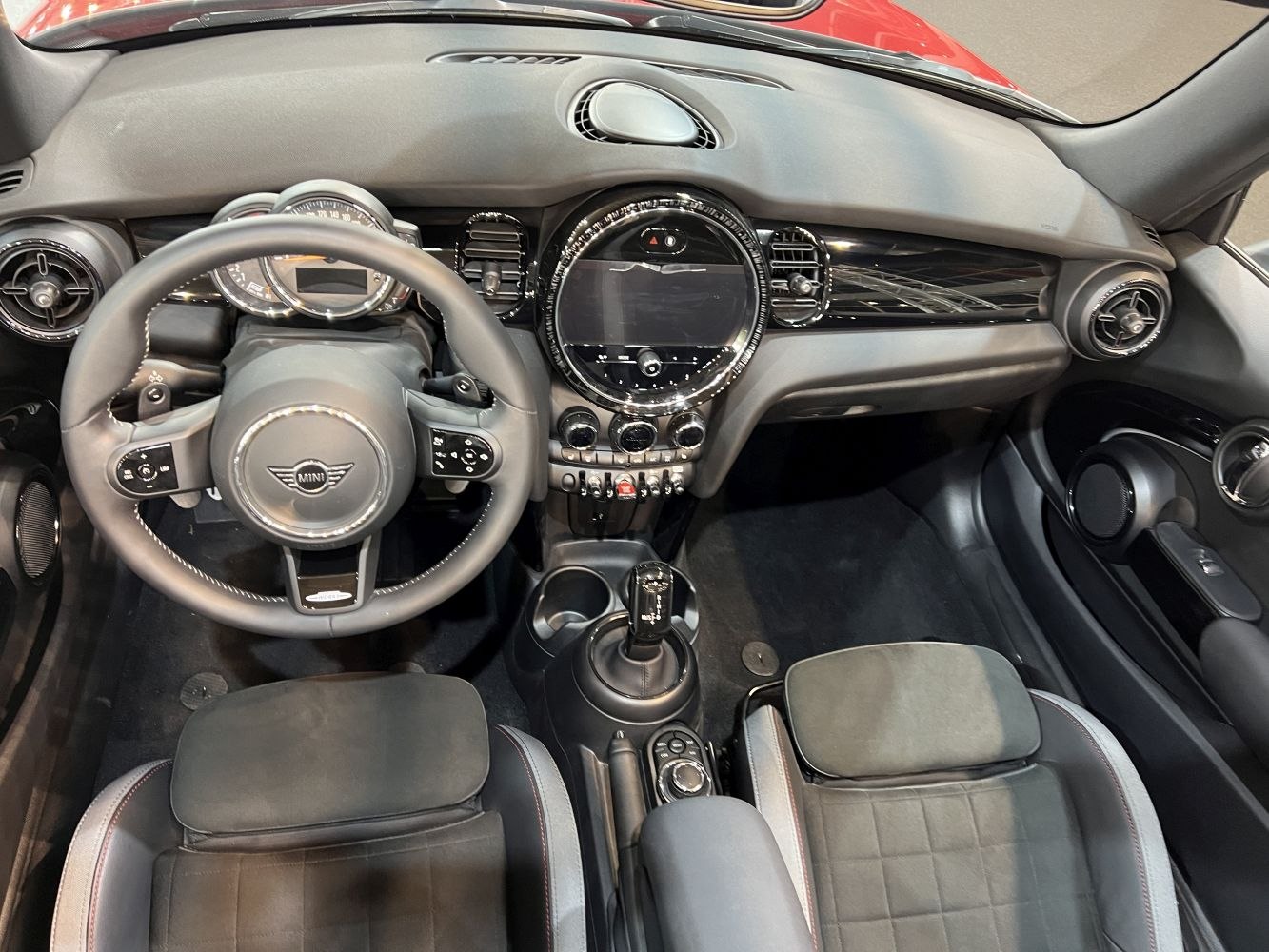 Interior view showing dashboard, steering wheel, and seats