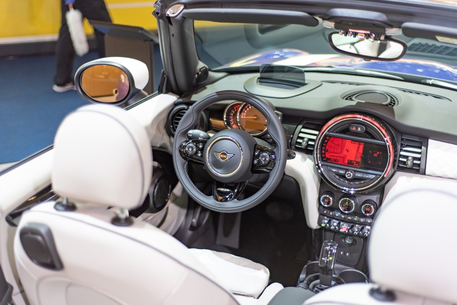 Convertible interior with steering wheel and digital dashboard display