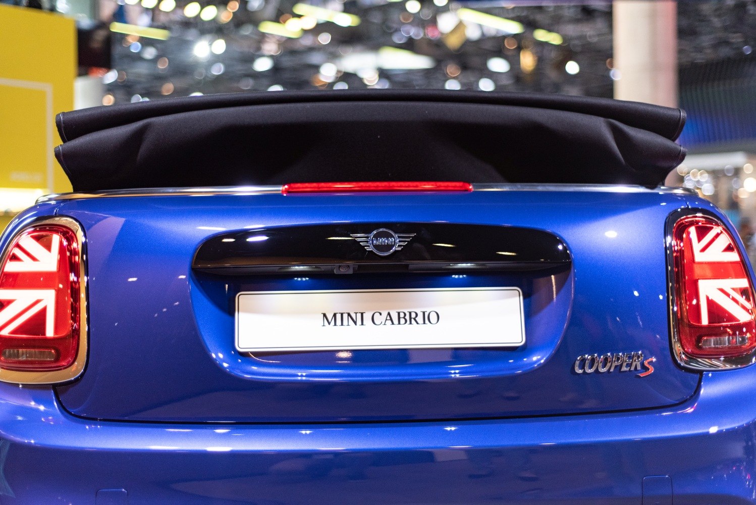 Rear view of convertible with Union Jack taillights and soft soft top roof