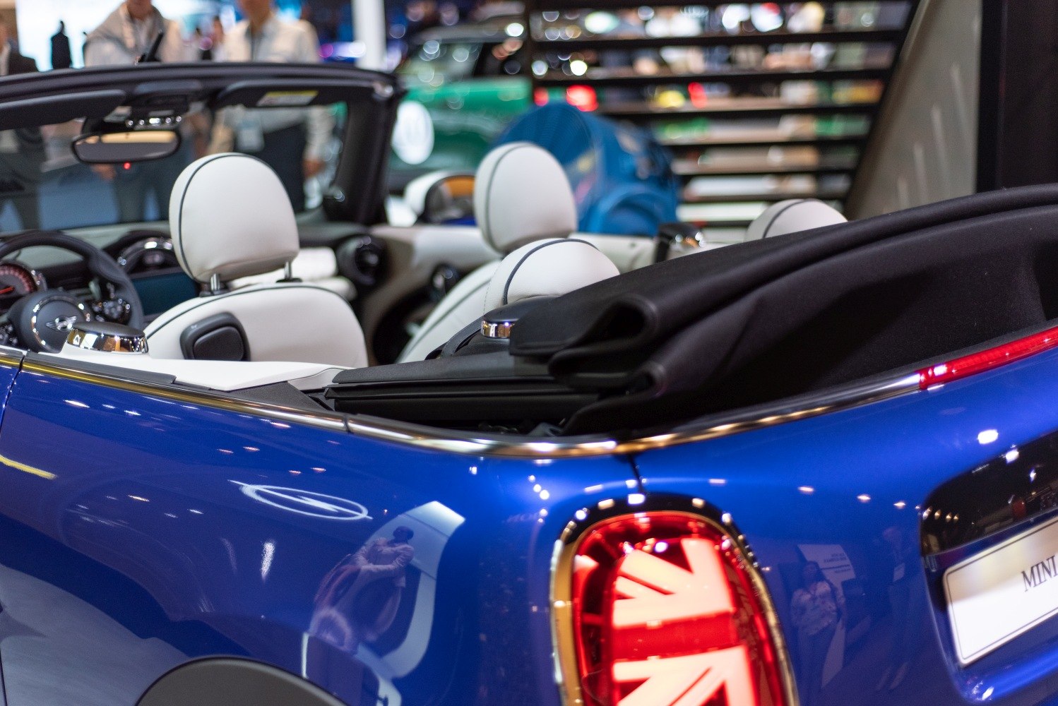 White interior seats and rear taillight of convertible with blue body