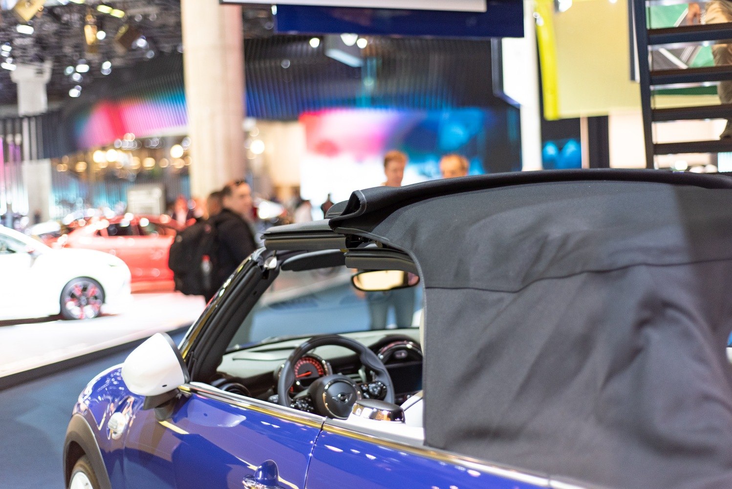Soft fabric convertible roof and interior steering wheel in blue vehicle