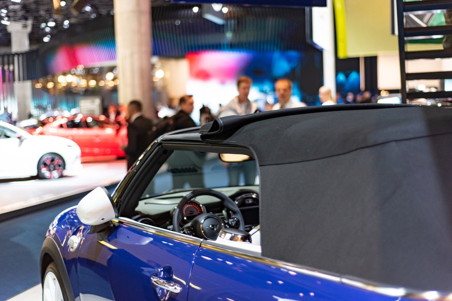 Soft top roof partially open and steering wheel visible