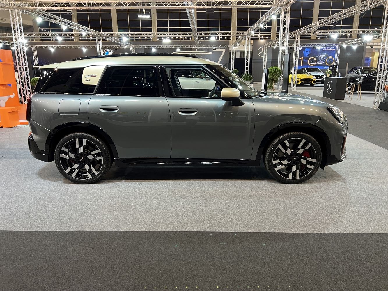 Side profile with distinctive alloy wheels and contrasting roof.