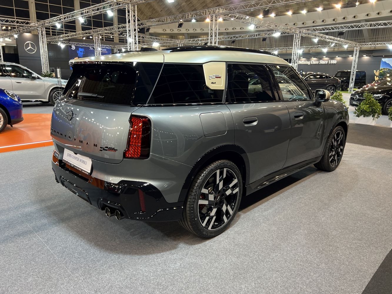 Rear-side view of a modern sporty Mini SUV with dual exhausts and distinct design elements