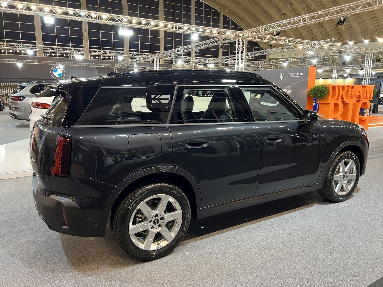 Side and rear view of a sleek black modern SUV with alloy wheels